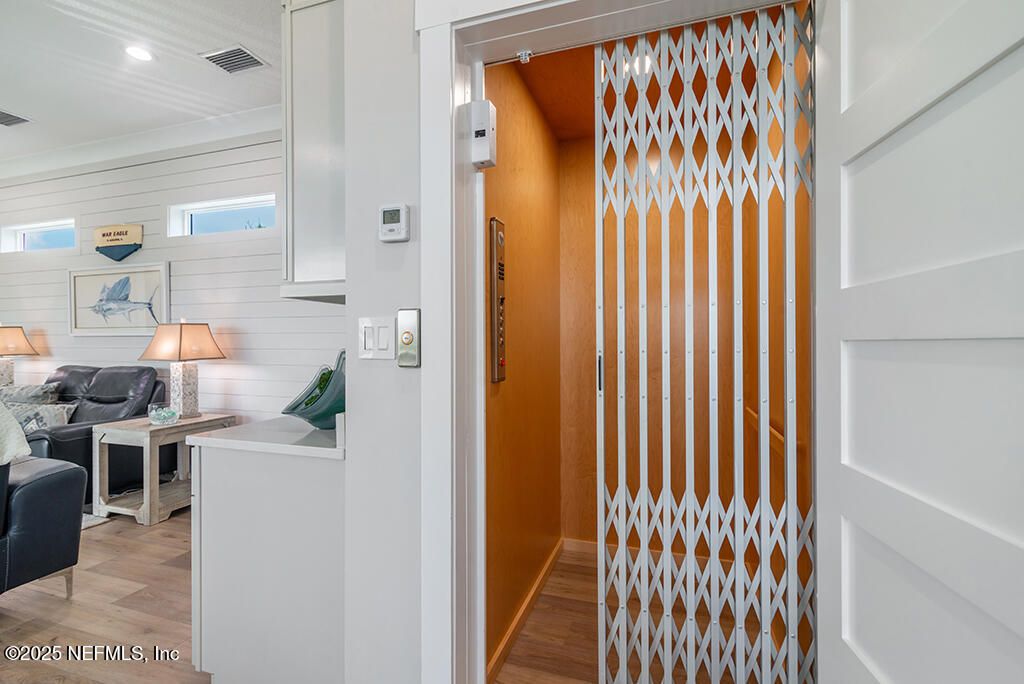 Elevator, Interior, Recessed Lighting, Wood Texture Flooring, Wooden Walls