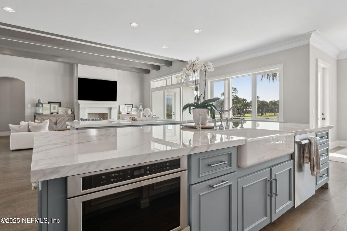 Chandelier, Fireplace, Interior, Kitchen, Living room, Recessed Lighting, Stainless Steel Appliances, Wood Texture Flooring