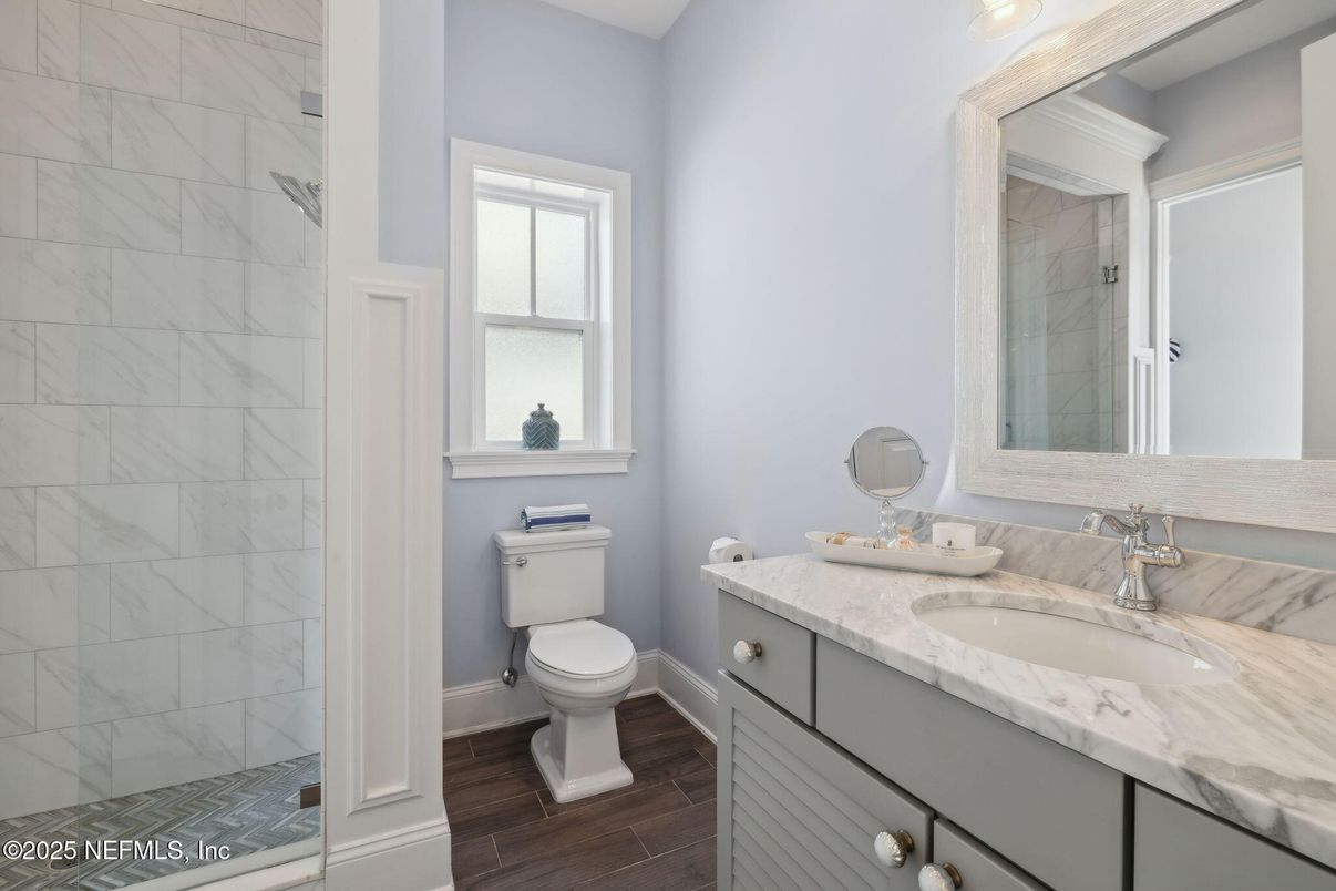 Bathroom, Dual Sink Vanities, Interior, Marble Walls, Wood Texture Flooring