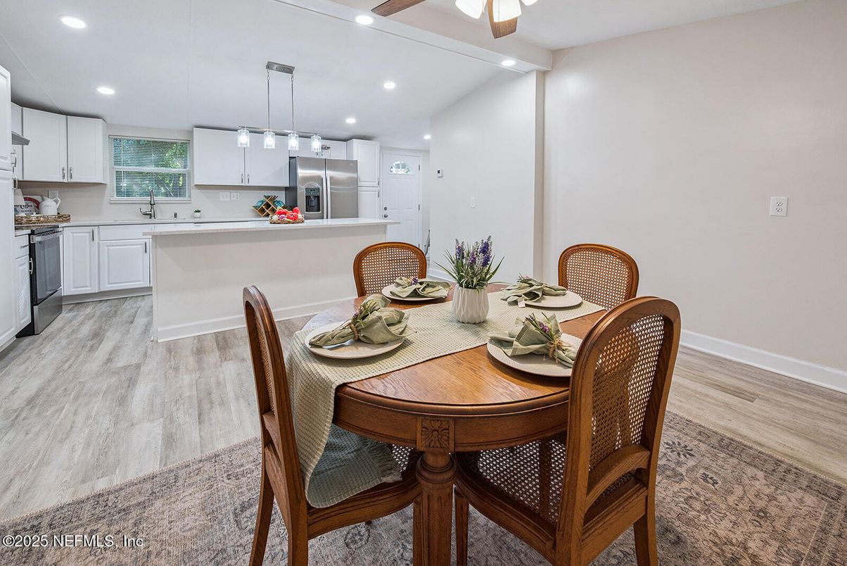 Dining room, Interior, Kitchen, Pendant Lights, Recessed Lighting, Stainless Steel Appliances, Wood Texture Flooring
