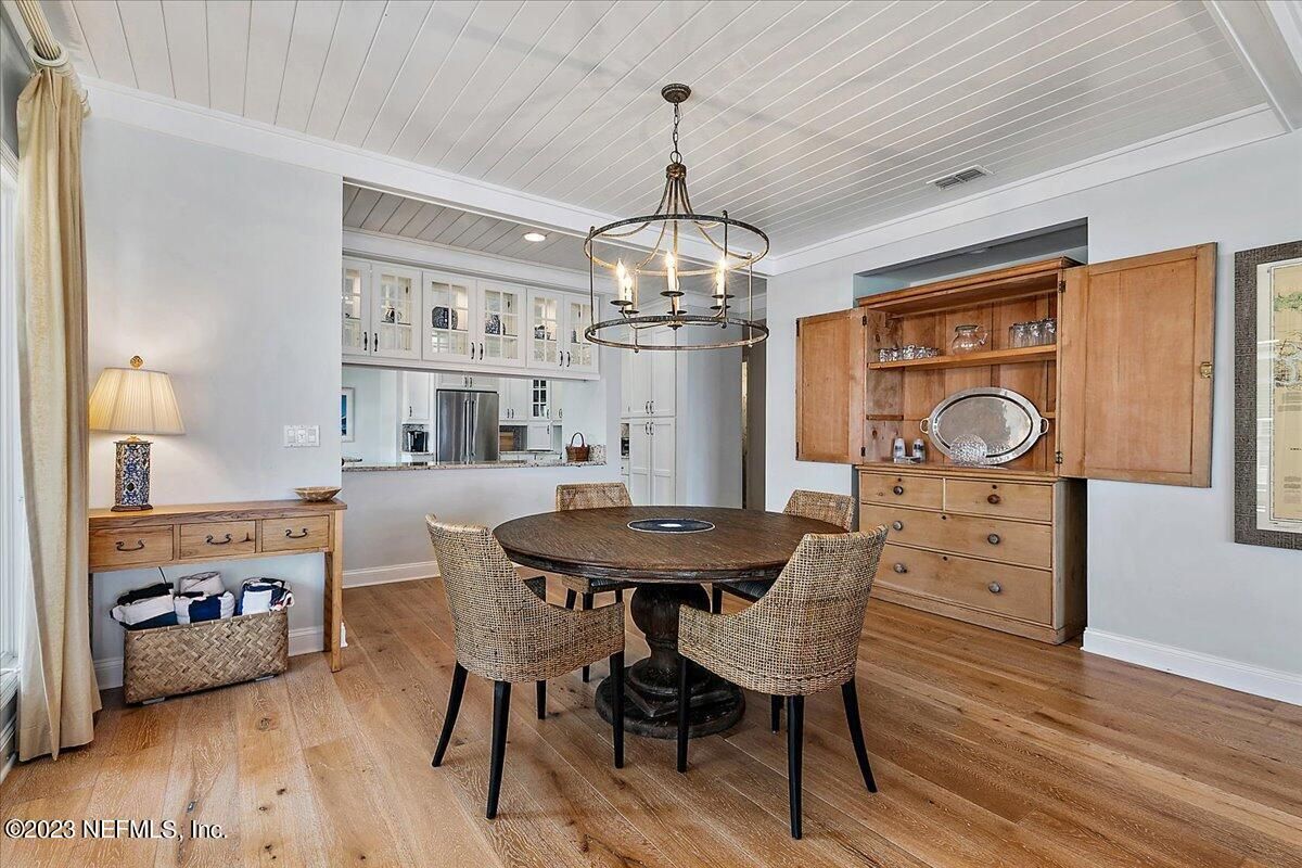 Chandelier, Dining room, Interior, Kitchen, Pendant Lights, Recessed Lighting, Stainless Steel Appliances, Wood Texture Flooring