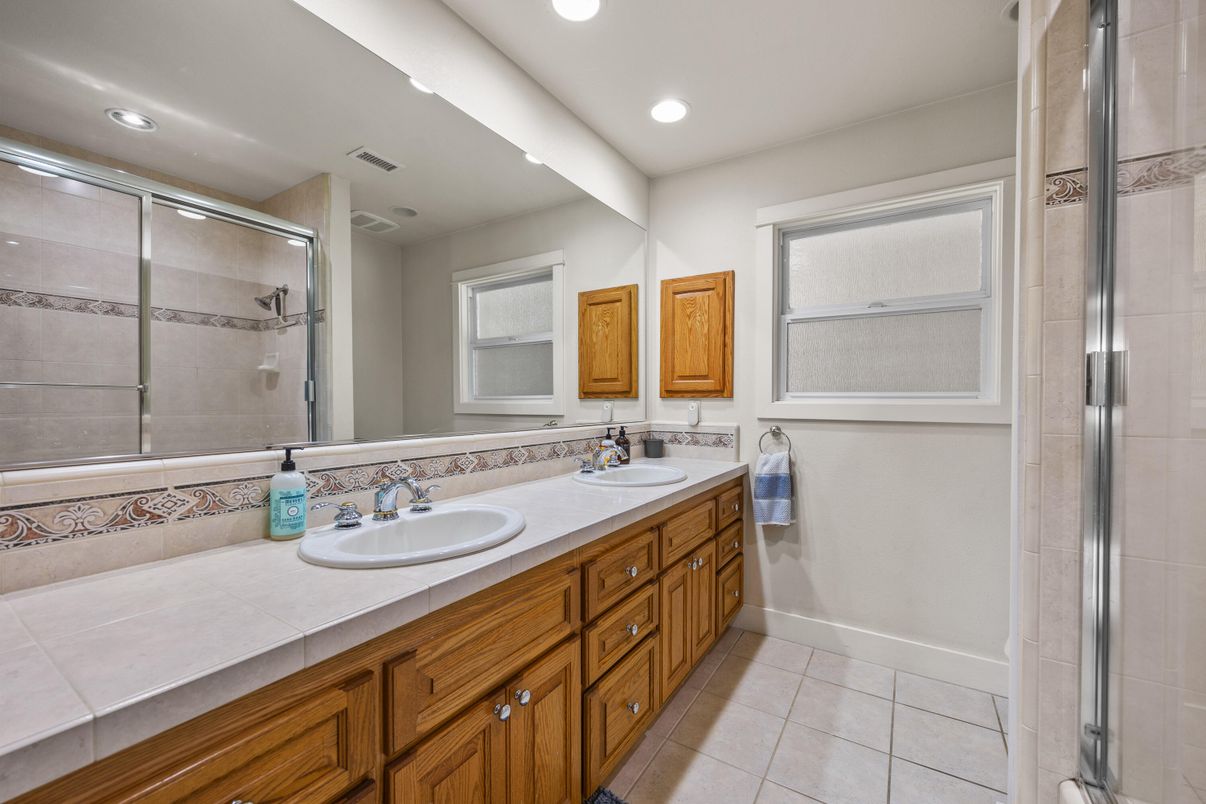 Bathroom, Dual Sink Vanities, Glass Shower, Interior, Recessed Lighting, Tile Countertops