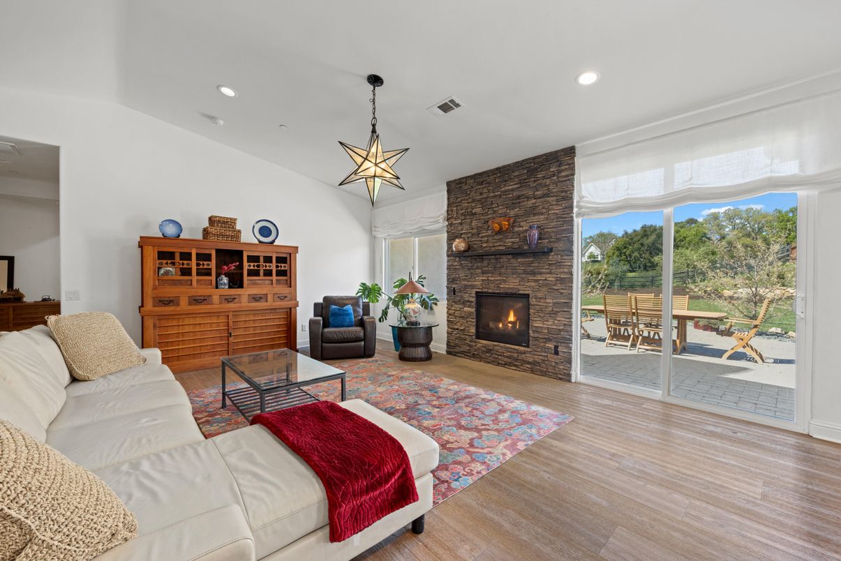 Fireplace, Interior, Living room, Pendant Lights, Recessed Lighting, Stone Walls, Wood Texture Flooring