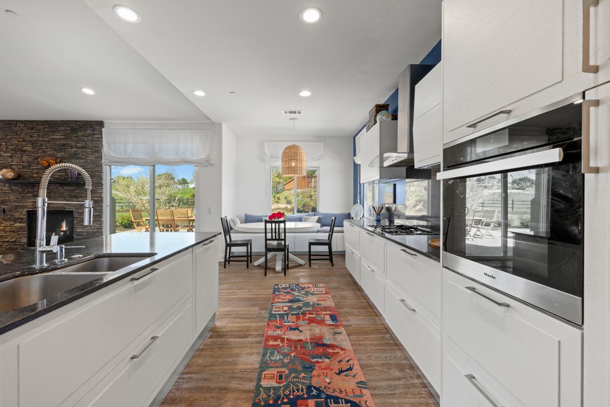 Dining room, Fireplace, Interior, Kitchen, Pendant Lights, Recessed Lighting, Stone Walls, Wood Texture Flooring