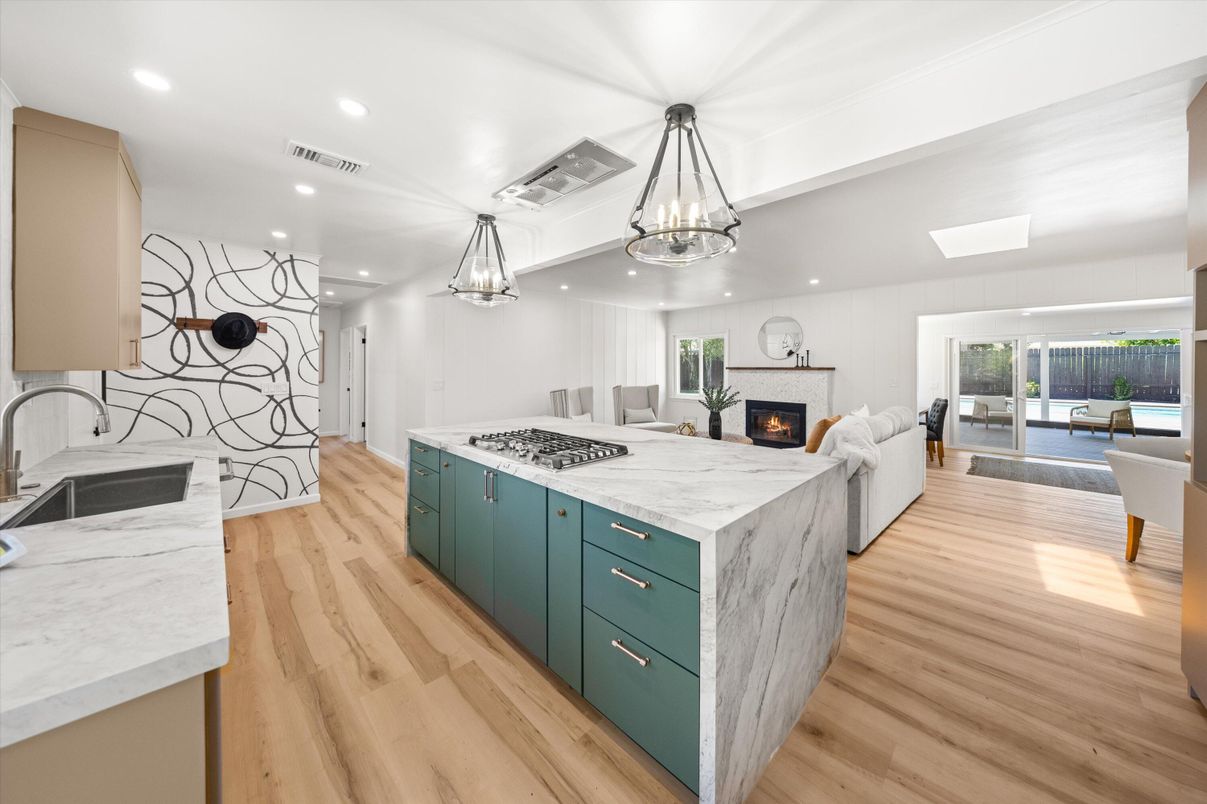 Chandelier, Fireplace, Interior, Kitchen, Living room, Pendant Lights, Recessed Lighting, Wood Texture Flooring