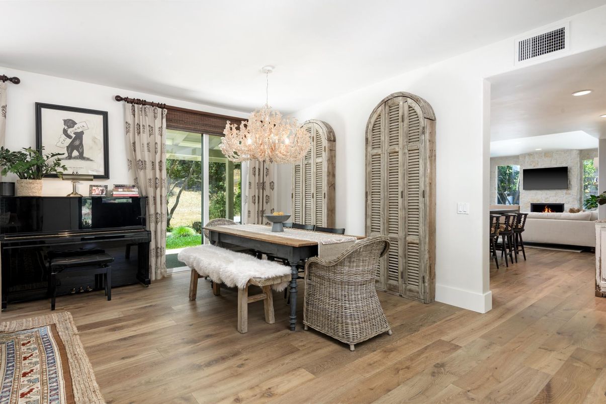 Chandelier, Dining room, Fireplace, Interior, Piano, Recessed Lighting, Stone Walls, Wood Texture Flooring