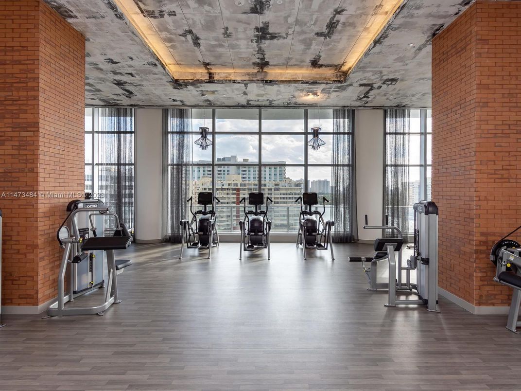 Fitness Equipment, Gym, Interior, Stone Walls, Wood Texture Flooring