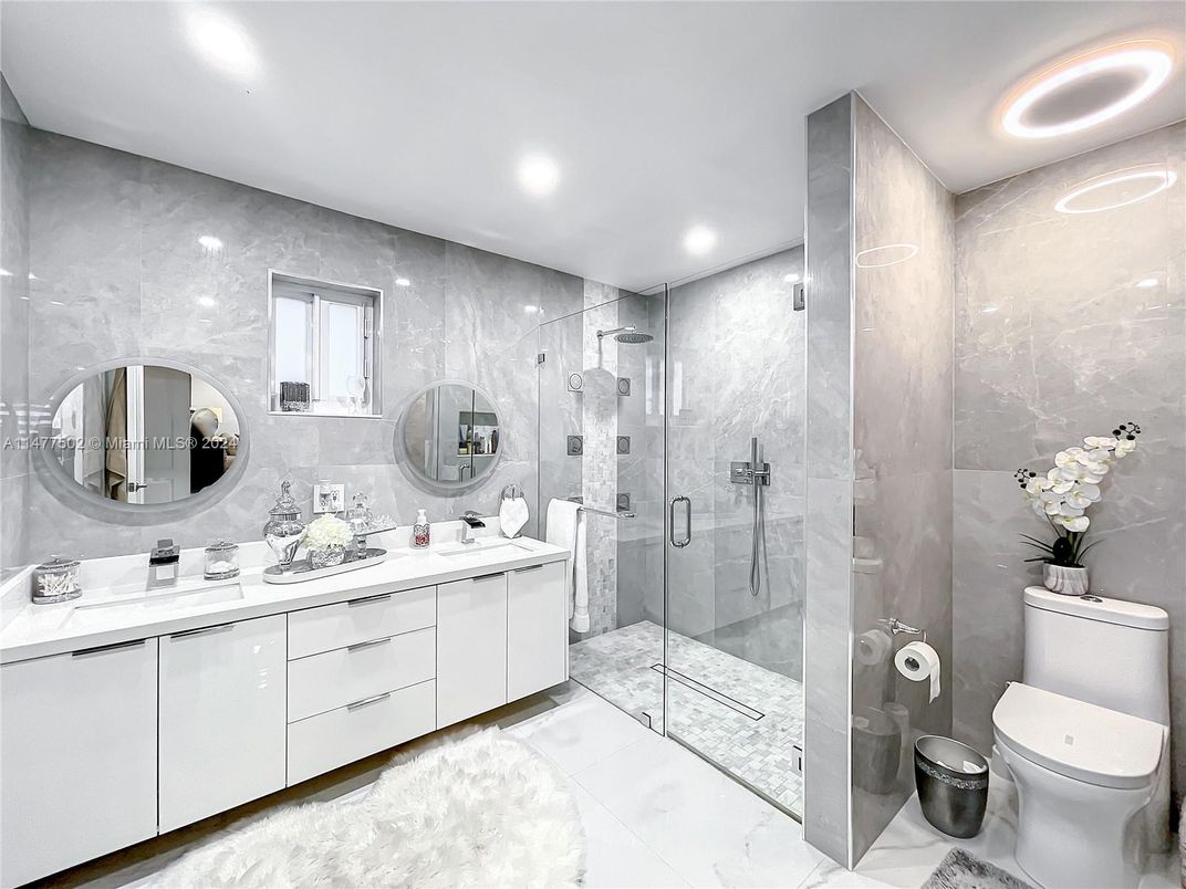 Bathroom, Dual Sink Vanities, Glass Shower, Interior, Marble, Marble Walls, Recessed Lighting