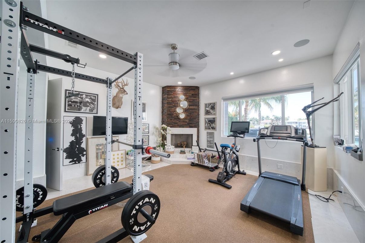 Fireplace, Fitness Equipment, Gym, Interior, Recessed Lighting, Stone Walls