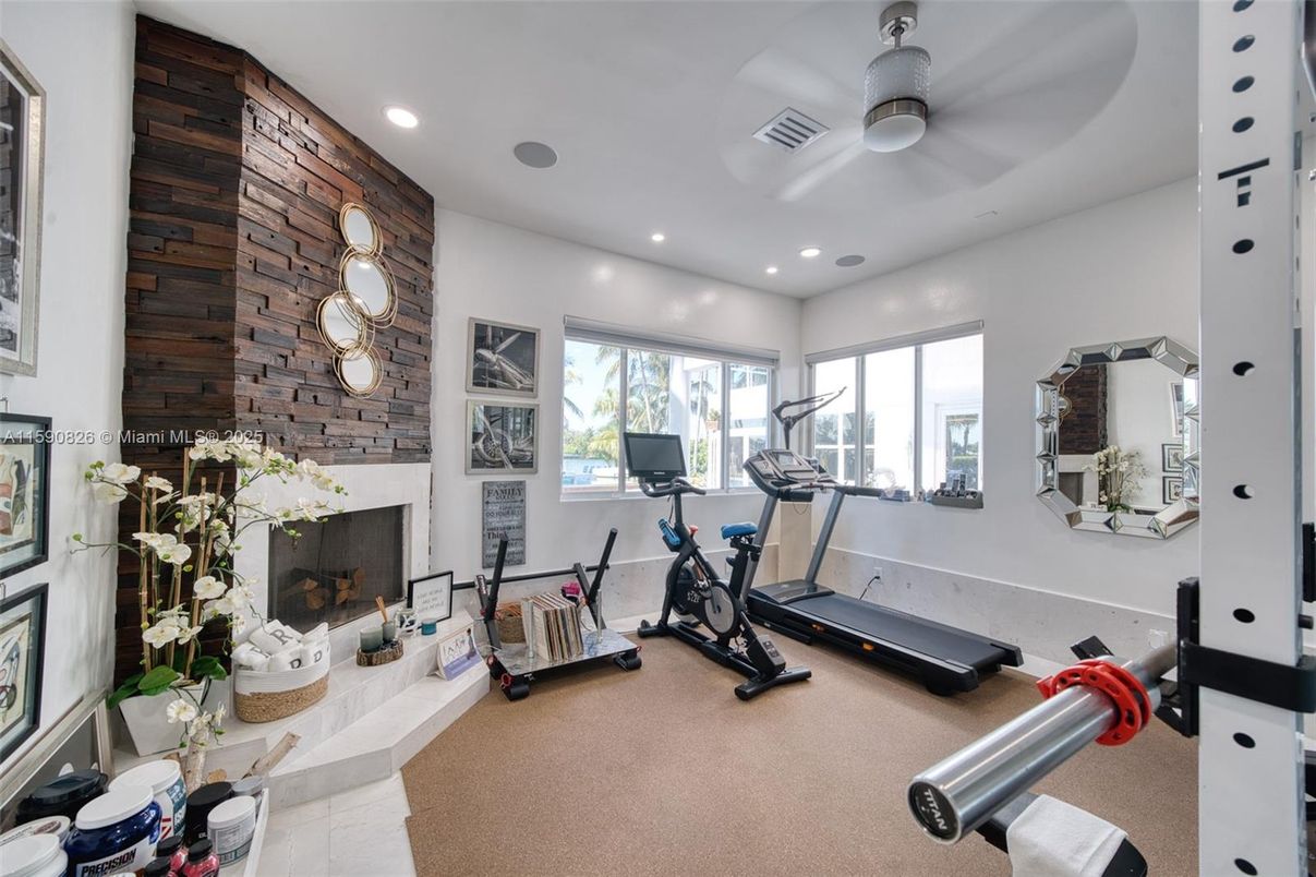Fireplace, Fitness Equipment, Interior, Recessed Lighting, Stone Walls