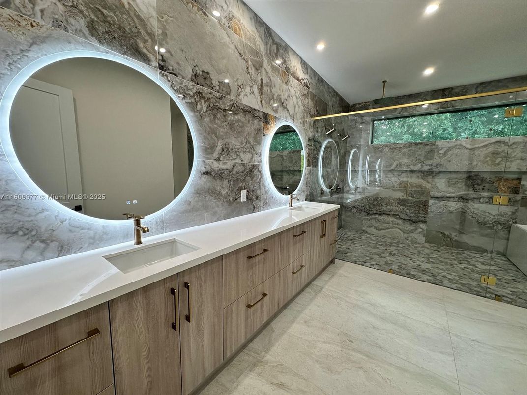 Bathroom, Dual Sink Vanities, Glass Shower, Interior, Marble Walls, Recessed Lighting