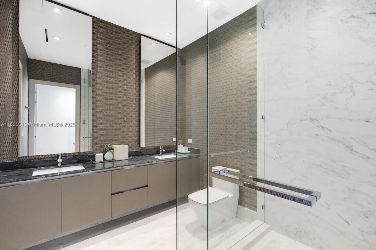 Bathroom, Dual Sink Vanities, Glass Shower, Interior, Marble Walls, Recessed Lighting