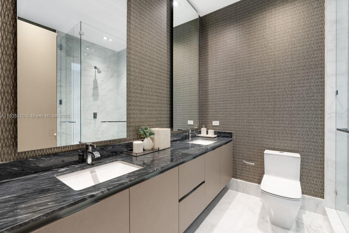 Bathroom, Dual Sink Vanities, Glass Shower, Interior, Marble, Marble Walls, Recessed Lighting