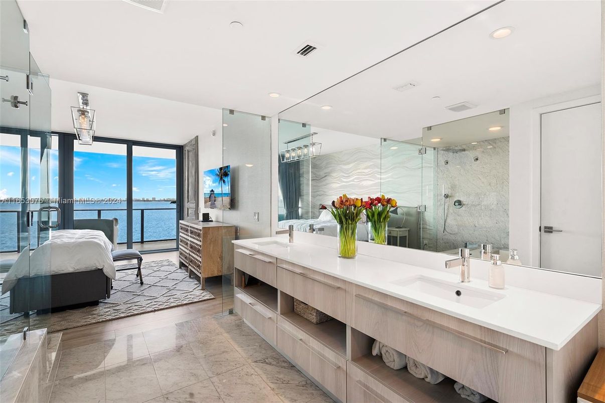 Bathroom, Dual Sink Vanities, Glass Shower, Interior, Marble Walls, Recessed Lighting, Water