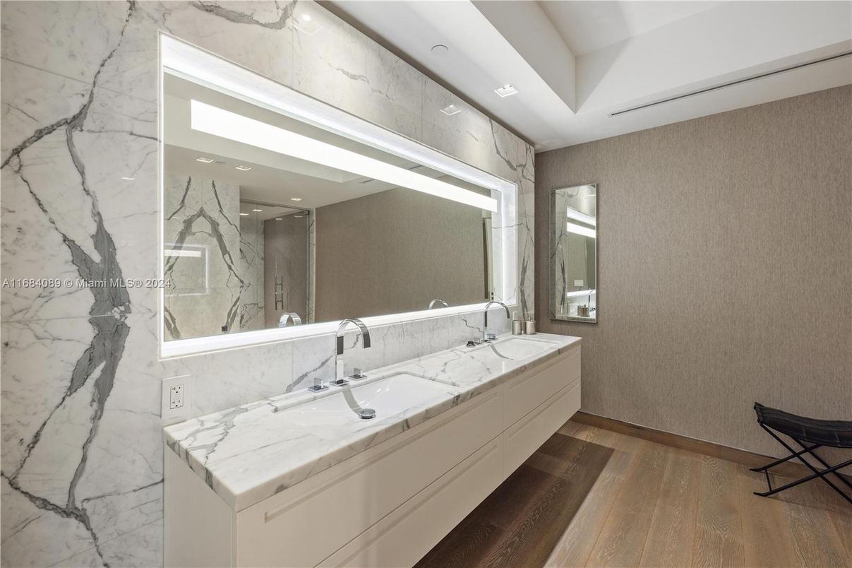 Bathroom, Dual Sink Vanities, Interior, Marble Walls, Recessed Lighting, Wood Texture Flooring
