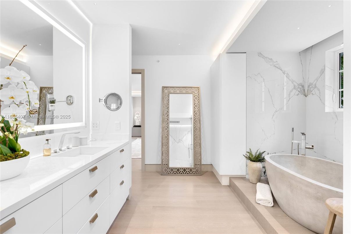 Bathroom, Dual Sink Vanities, Free Standing Baths, Interior, Marble Walls, Recessed Lighting, Wood Texture Flooring