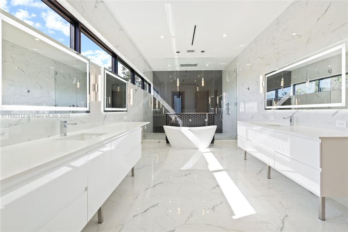 Bathroom, Dual Sink Vanities, Free Standing Baths, Glass Shower, Interior, Marble, Marble Walls, Pendant Lights, Recessed Lighting