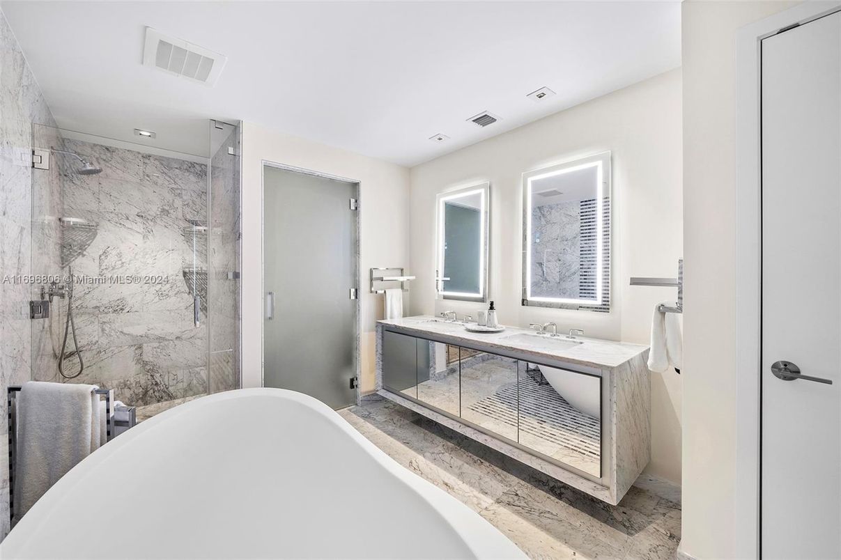Bathroom, Dual Sink Vanities, Free Standing Baths, Glass Shower, Interior, Marble Walls, Recessed Lighting