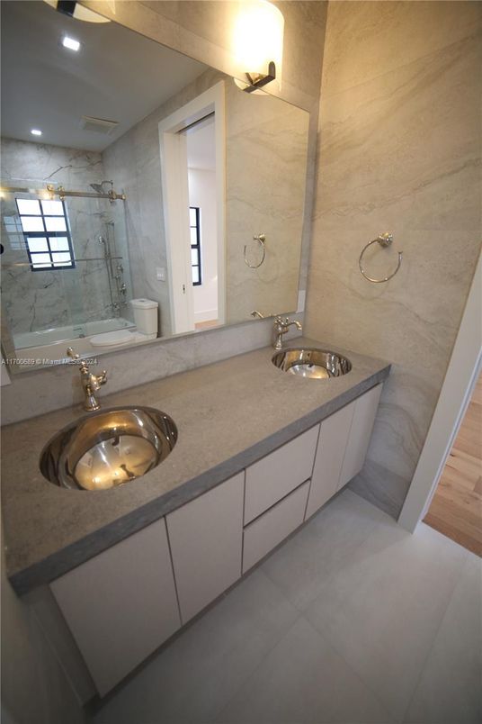 Bathroom, Dual Sink Vanities, Interior, Marble Walls, Recessed Lighting