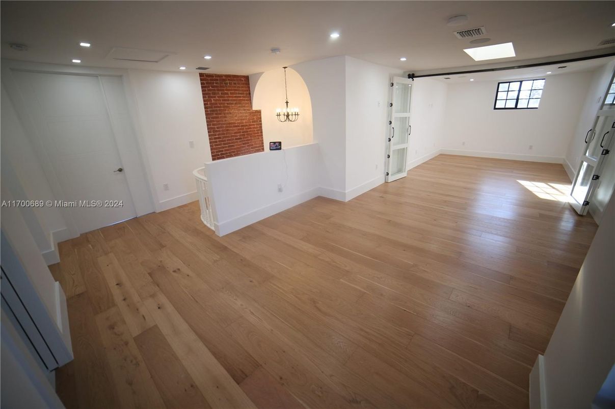 Empty room, Interior, Recessed Lighting, Stone Walls, Wood Texture Flooring
