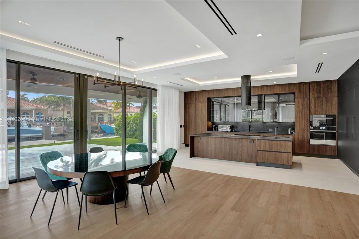 Dining room, Interior, Kitchen, Pendant Lights, Recessed Lighting, Stainless Steel Appliances, Wood Texture Flooring