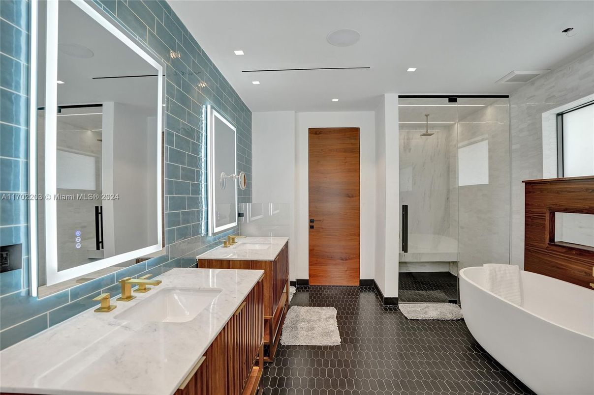 Bathroom, Dual Sink Vanities, Free Standing Baths, Glass Shower, Interior, Marble Walls, Recessed Lighting
