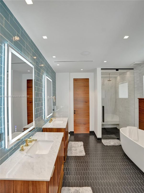Bathroom, Dual Sink Vanities, Free Standing Baths, Glass Shower, Interior, Marble Walls, Recessed Lighting