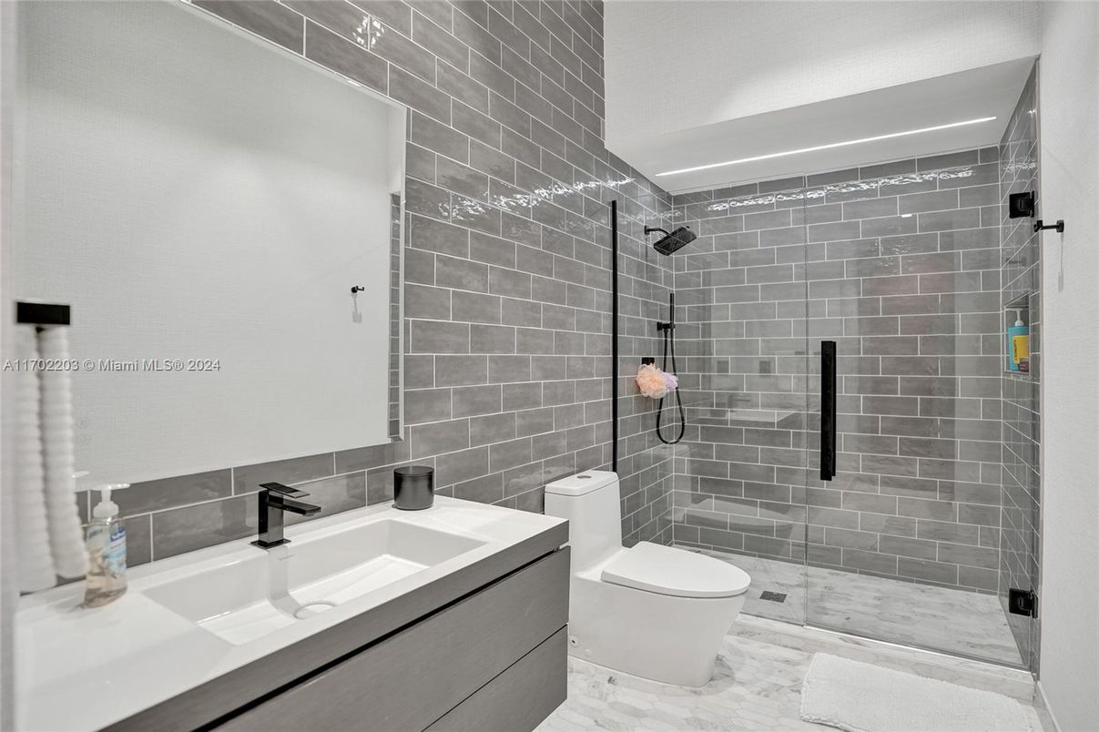 Bathroom, Glass Shower, Interior, Stone Walls, Wood Texture Flooring