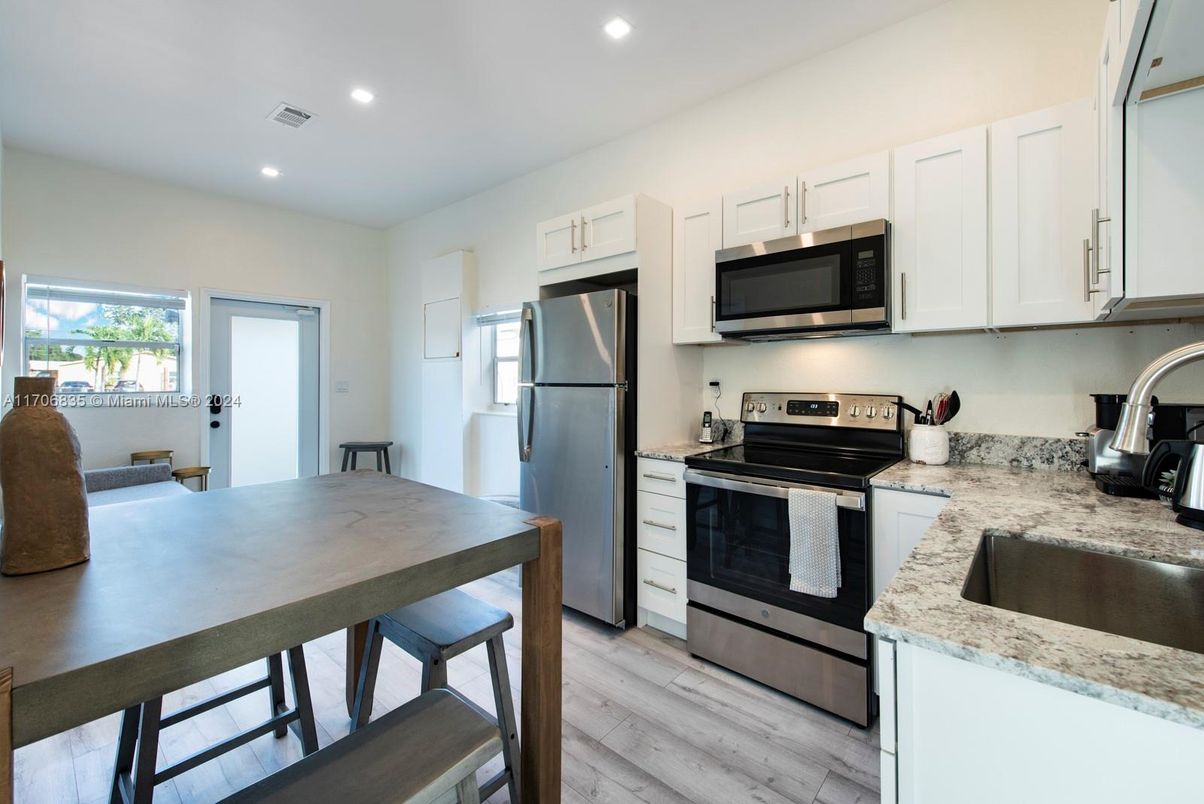Interior, Kitchen, Recessed Lighting, Stainless Steel Appliances, Wood Texture Flooring