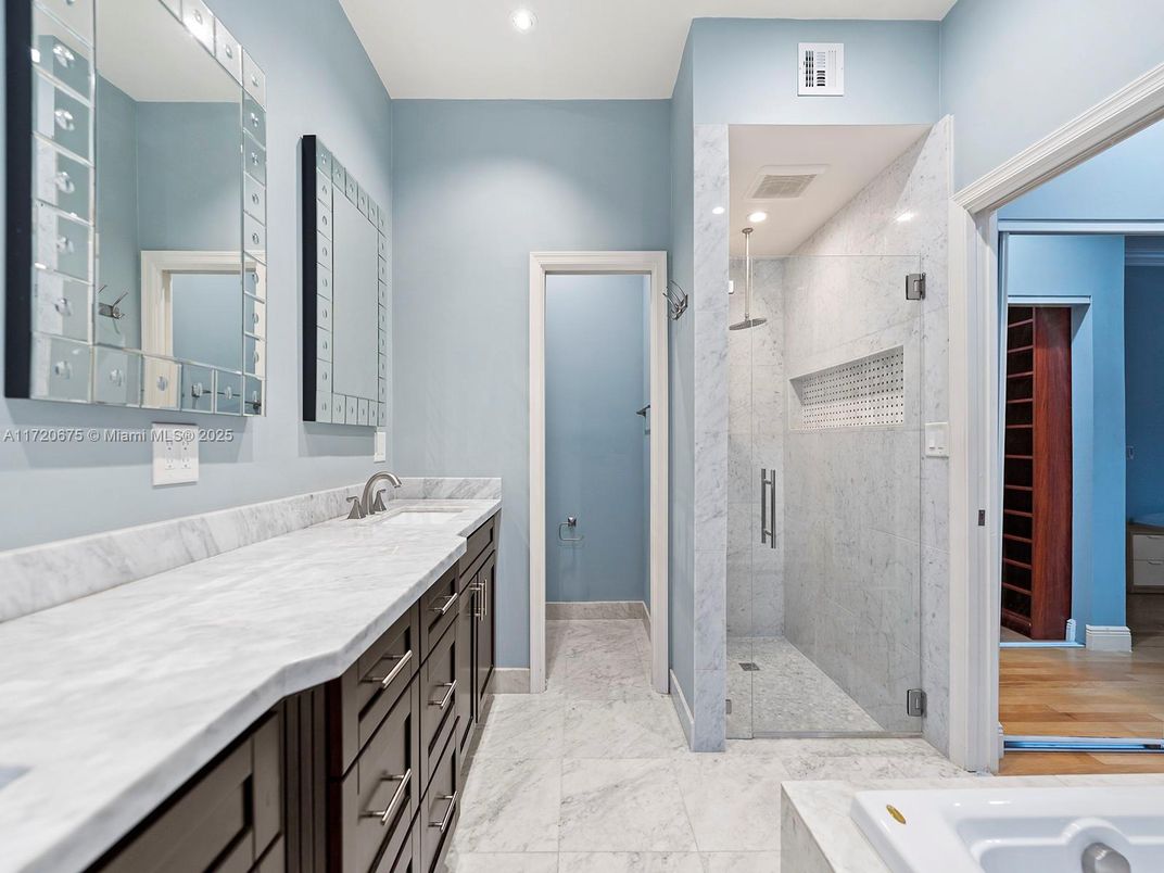 Bathroom, Dual Sink Vanities, Glass Shower, Interior, Marble, Marble Walls, Recessed Lighting