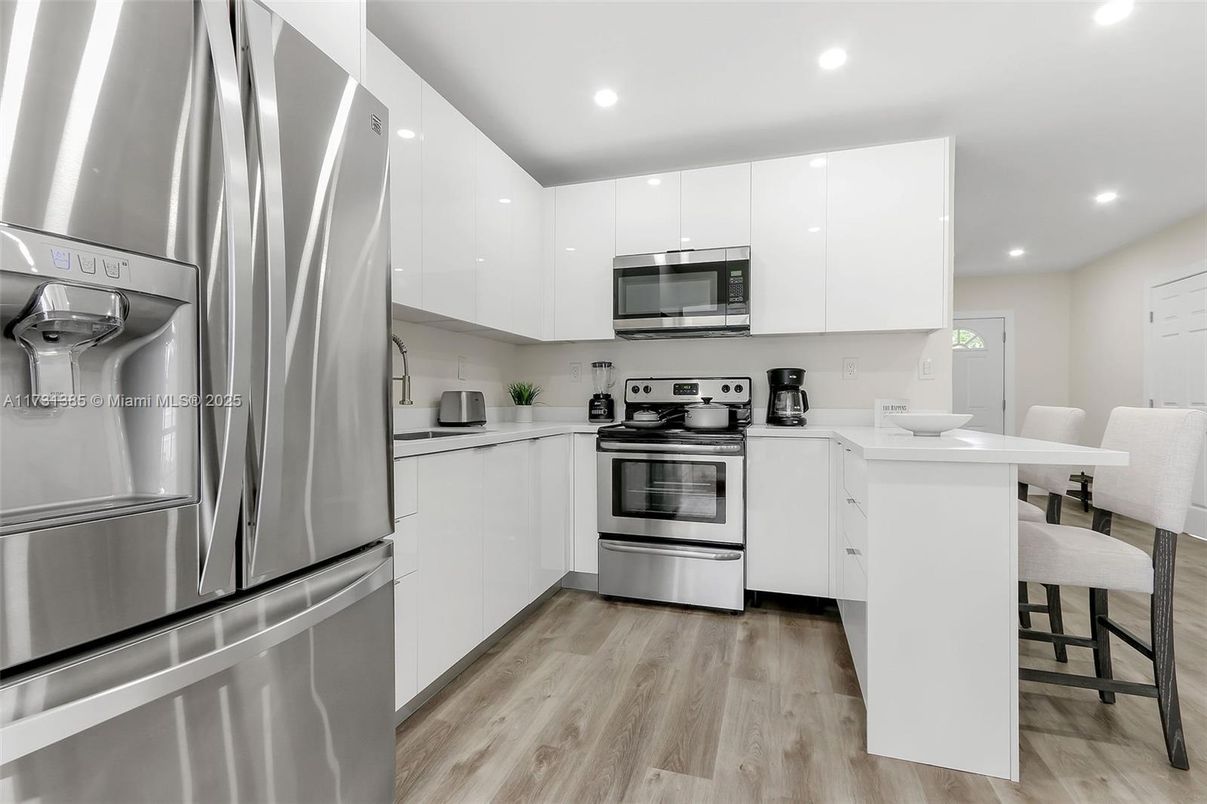 Interior, Kitchen, Recessed Lighting, Stainless Steel Appliances, Wood Texture Flooring