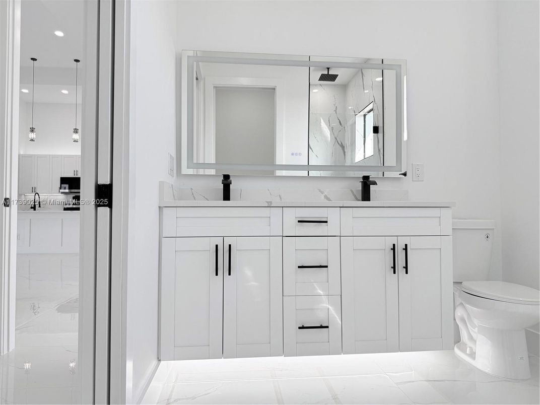 Bathroom, Dual Sink Vanities, Interior, Marble, Pendant Lights, Recessed Lighting