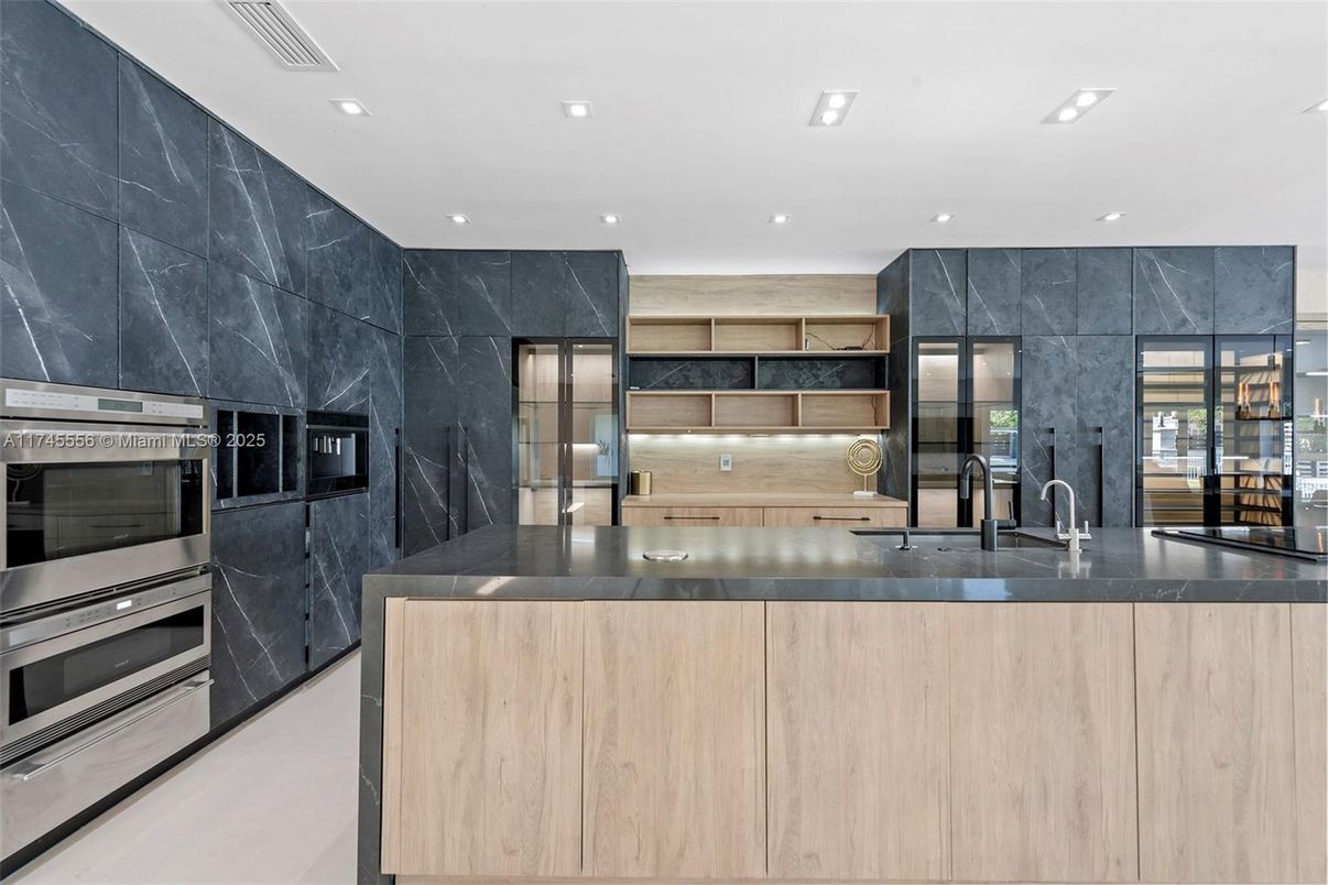 Interior, Kitchen, Marble Walls, Recessed Lighting, Stainless Steel Appliances
