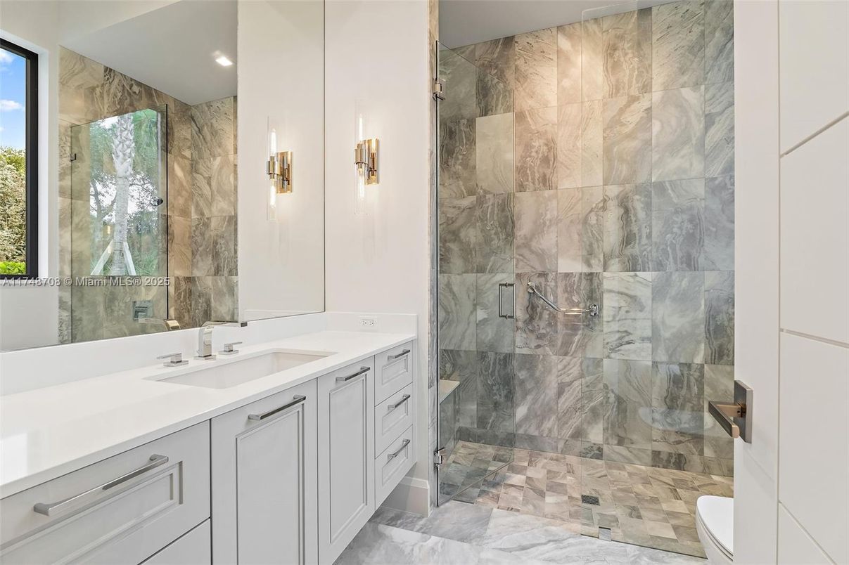 Bathroom, Dual Sink Vanities, Glass Shower, Interior, Marble, Marble Walls, Recessed Lighting
