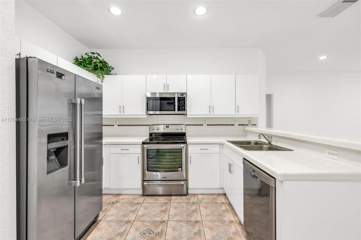 Interior, Kitchen, Recessed Lighting, Stainless Steel Appliances, Tile Countertops