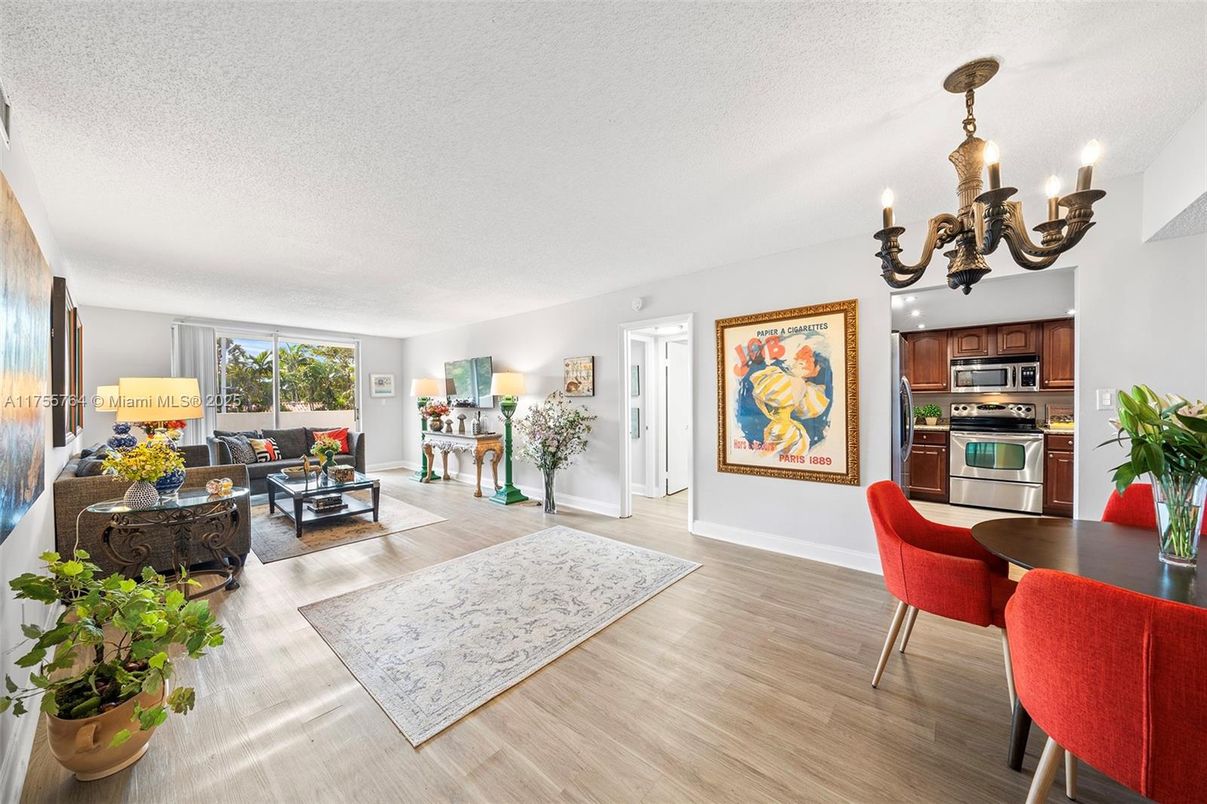 Chandelier, Dining room, Interior, Kitchen, Living room, Stainless Steel Appliances, Wood Texture Flooring