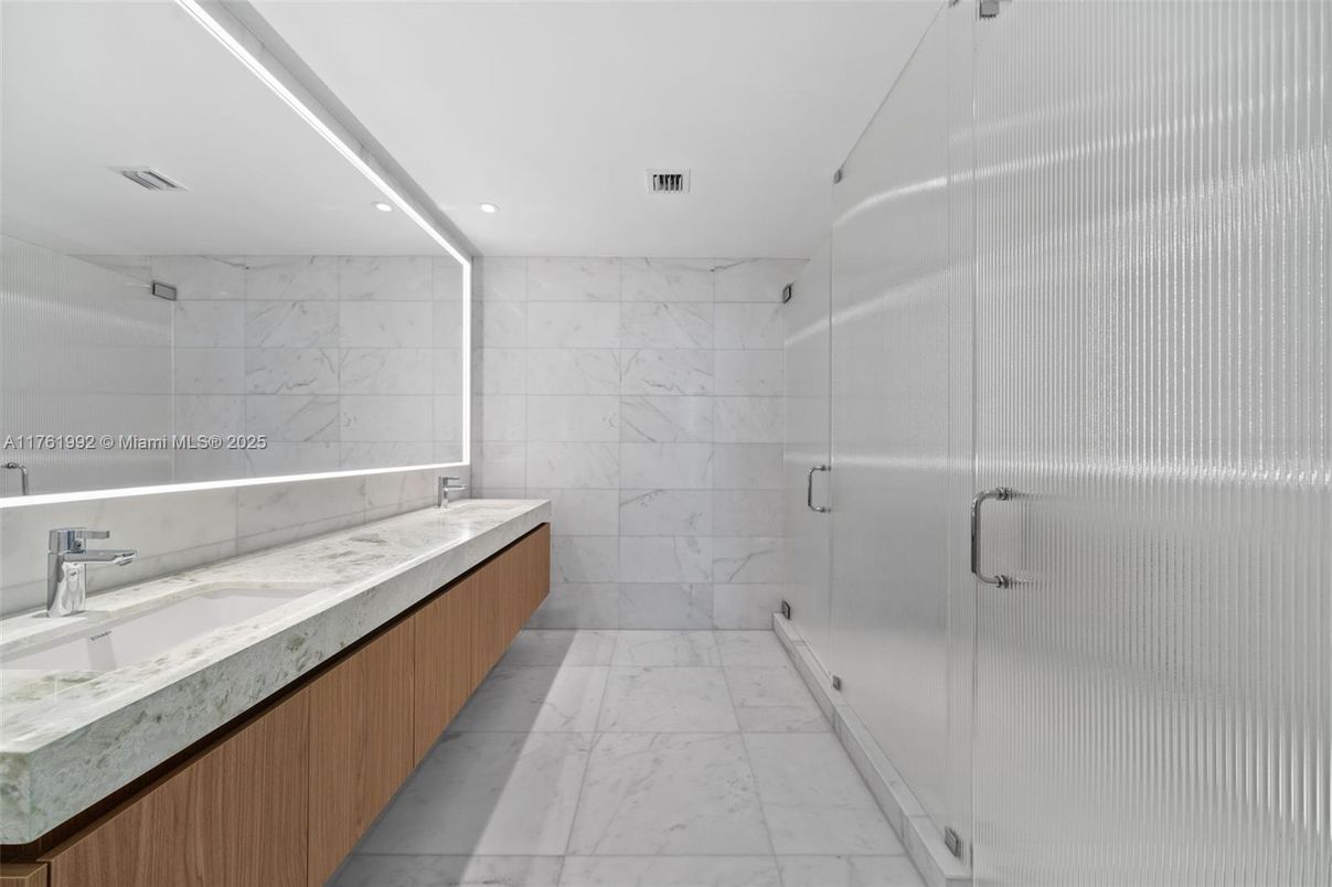 Bathroom, Dual Sink Vanities, Glass Shower, Interior, Marble, Marble Walls, Recessed Lighting