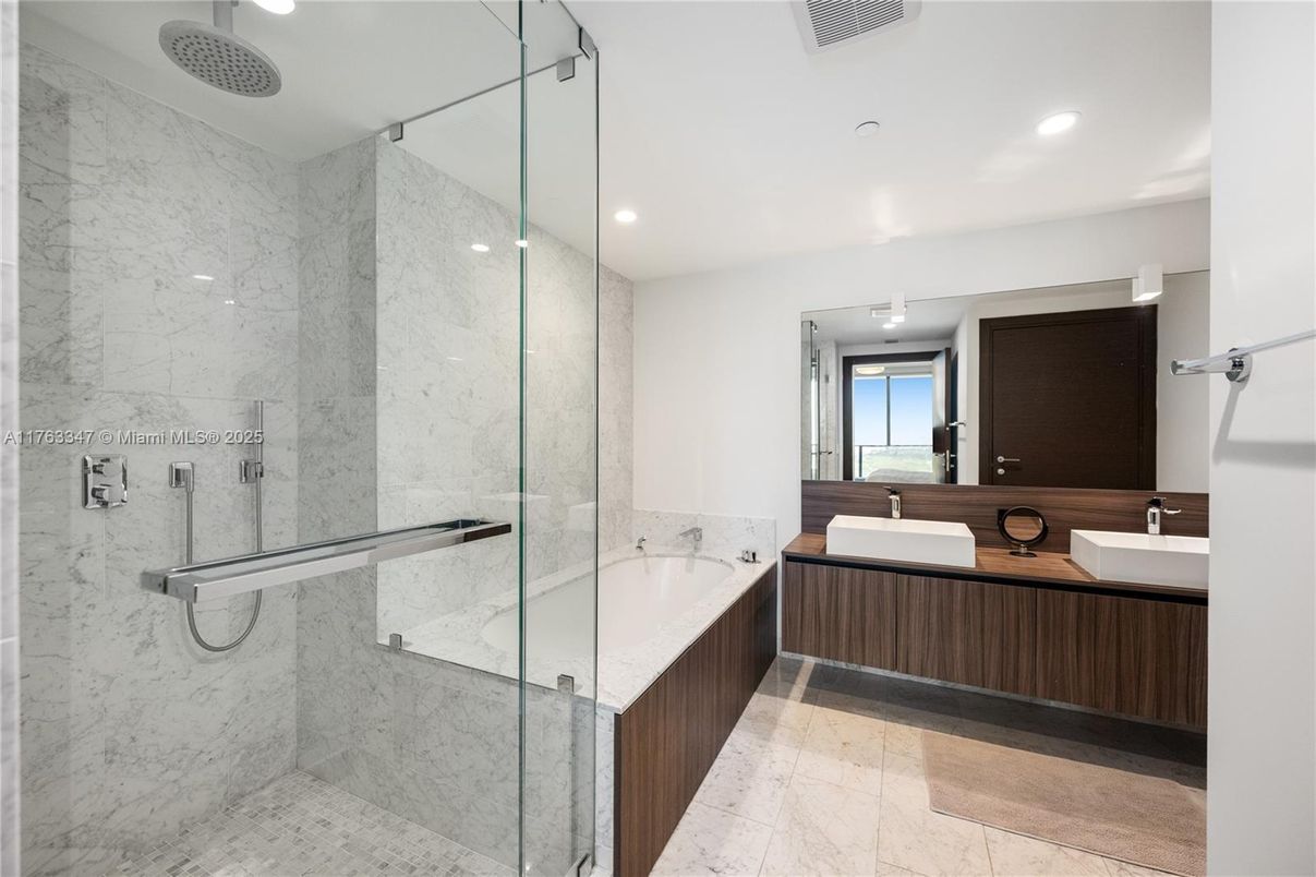 Bathroom, Dual Sink Vanities, Glass Shower, Interior, Marble, Marble Walls, Recessed Lighting
