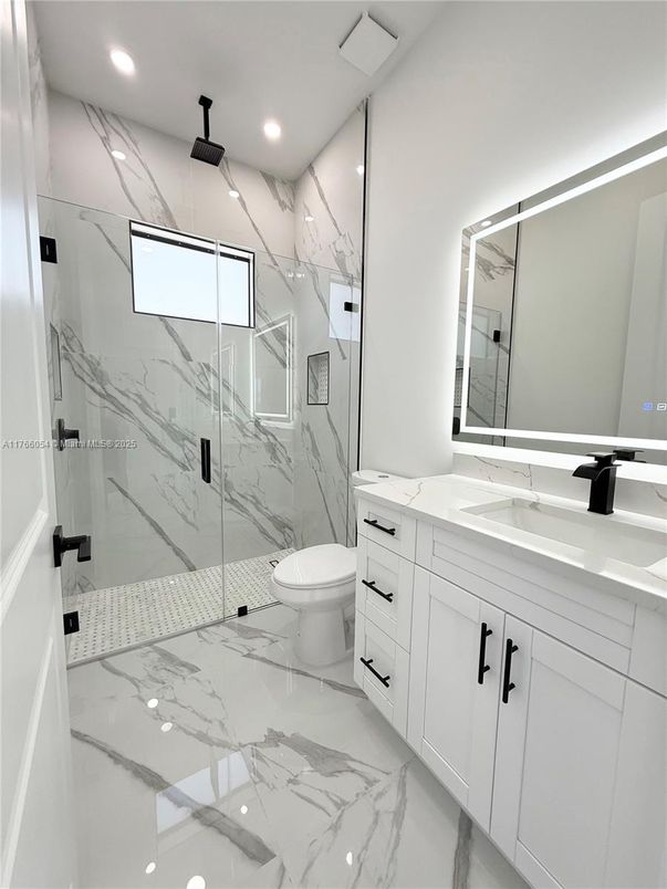Bathroom, Dual Sink Vanities, Glass Shower, Interior, Marble, Marble Walls, Recessed Lighting