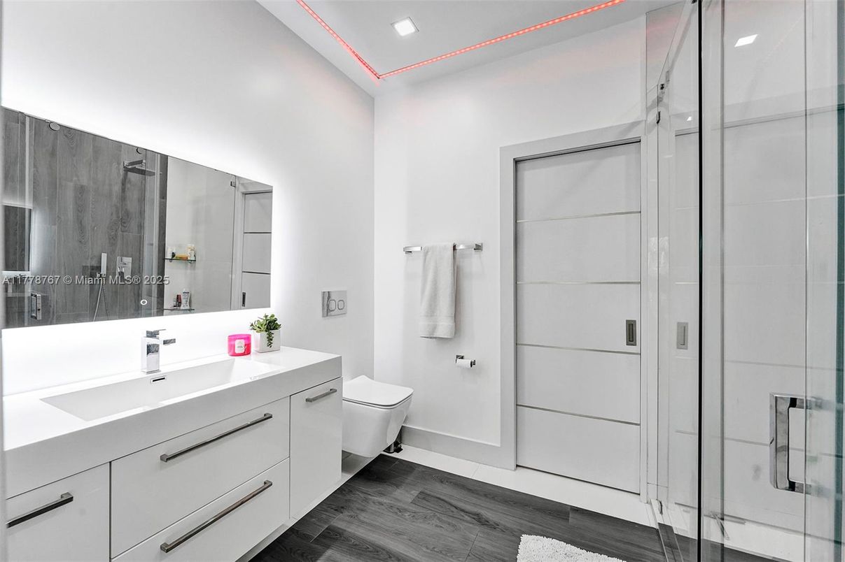 Bathroom, Dual Sink Vanities, Glass Shower, Interior, Recessed Lighting, Wood Texture Flooring