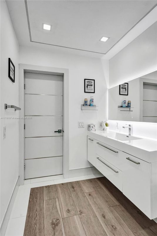 Bathroom, Dual Sink Vanities, Interior, Recessed Lighting, Wood Texture Flooring
