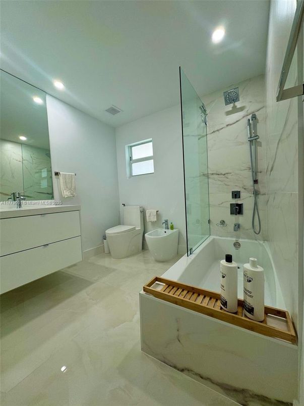 Bathroom, Free Standing Baths, Glass Shower, Interior, Marble Walls, Recessed Lighting