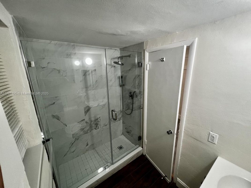 Bathroom, Glass Shower, Interior, Marble Walls, Wood Texture Flooring