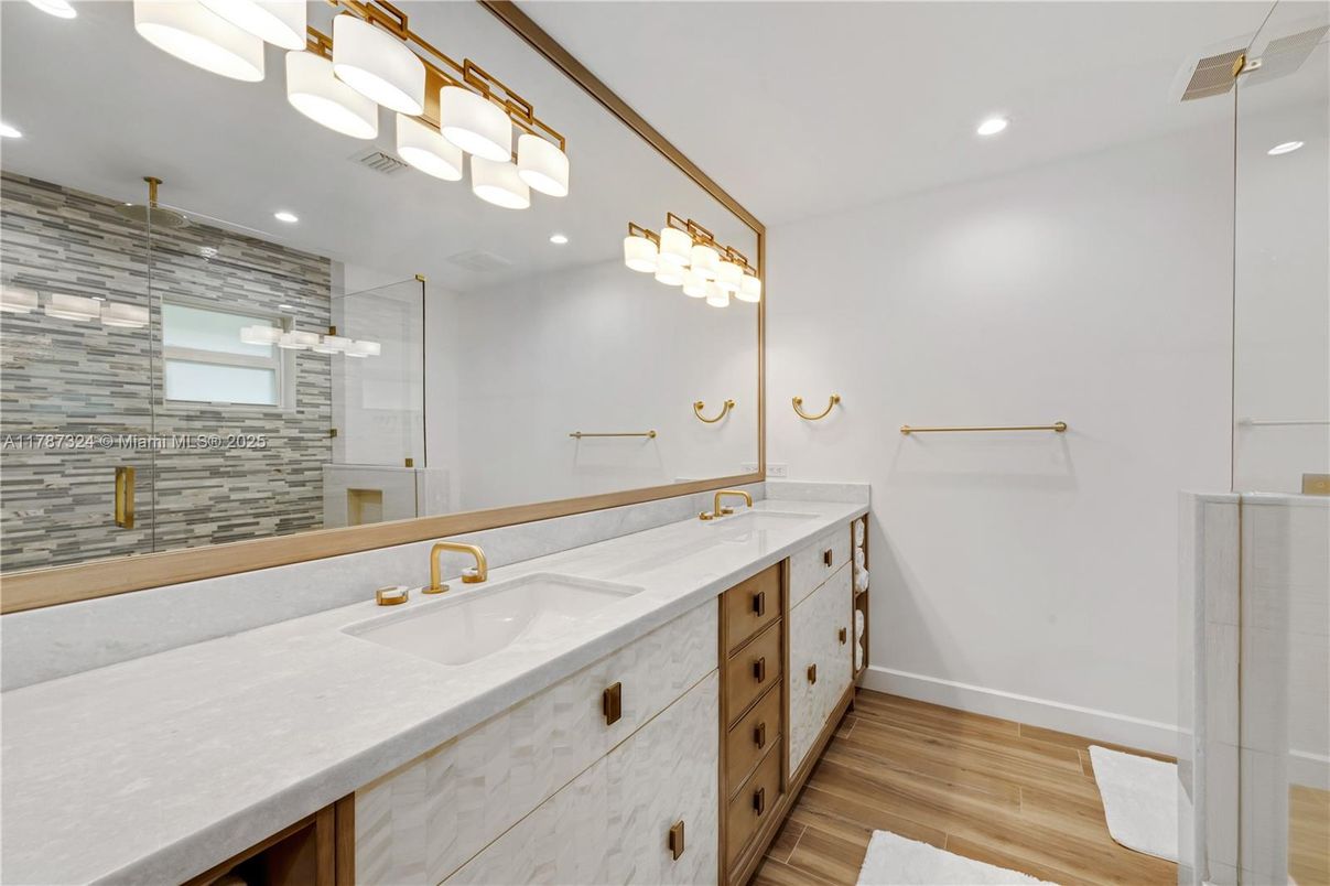 Bathroom, Dual Sink Vanities, Glass Shower, Interior, Recessed Lighting, Wood Texture Flooring