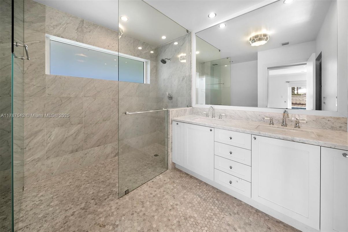 Bathroom, Dual Sink Vanities, Glass Shower, Interior, Marble Walls, Recessed Lighting