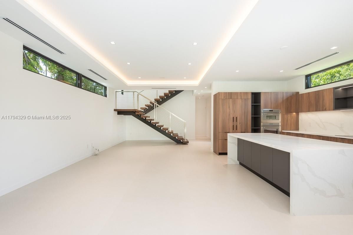 Interior, Kitchen, Marble Walls, Recessed Lighting, Stainless Steel Appliances