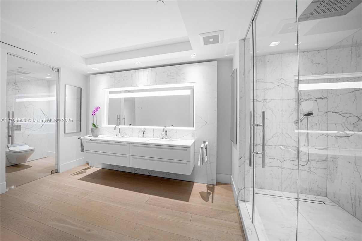 Bathroom, Free Standing Baths, Glass Shower, Interior, Marble Walls, Recessed Lighting, Wood Texture Flooring