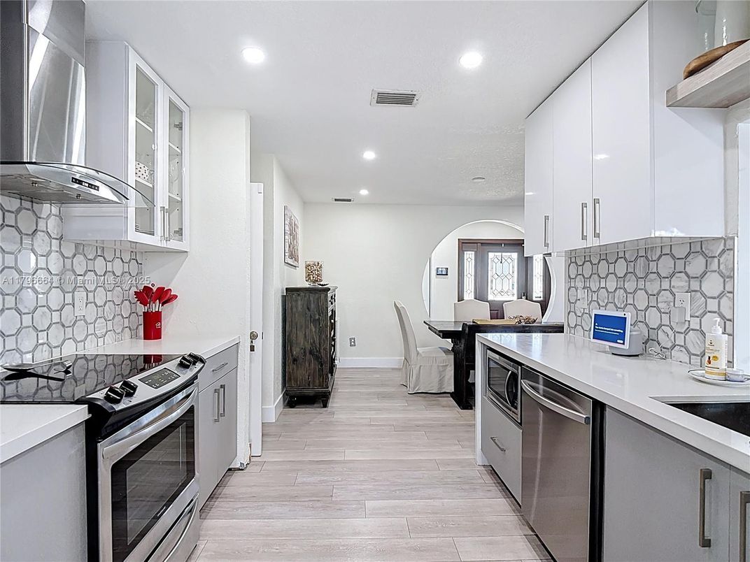 Dining room, Interior, Kitchen, Recessed Lighting, Stainless Steel Appliances, Wood Texture Flooring