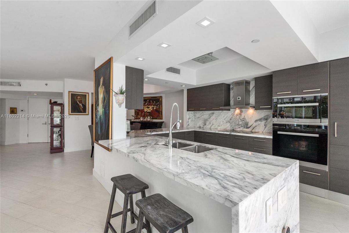 Interior, Kitchen, Marble Walls, Recessed Lighting, Stainless Steel Appliances