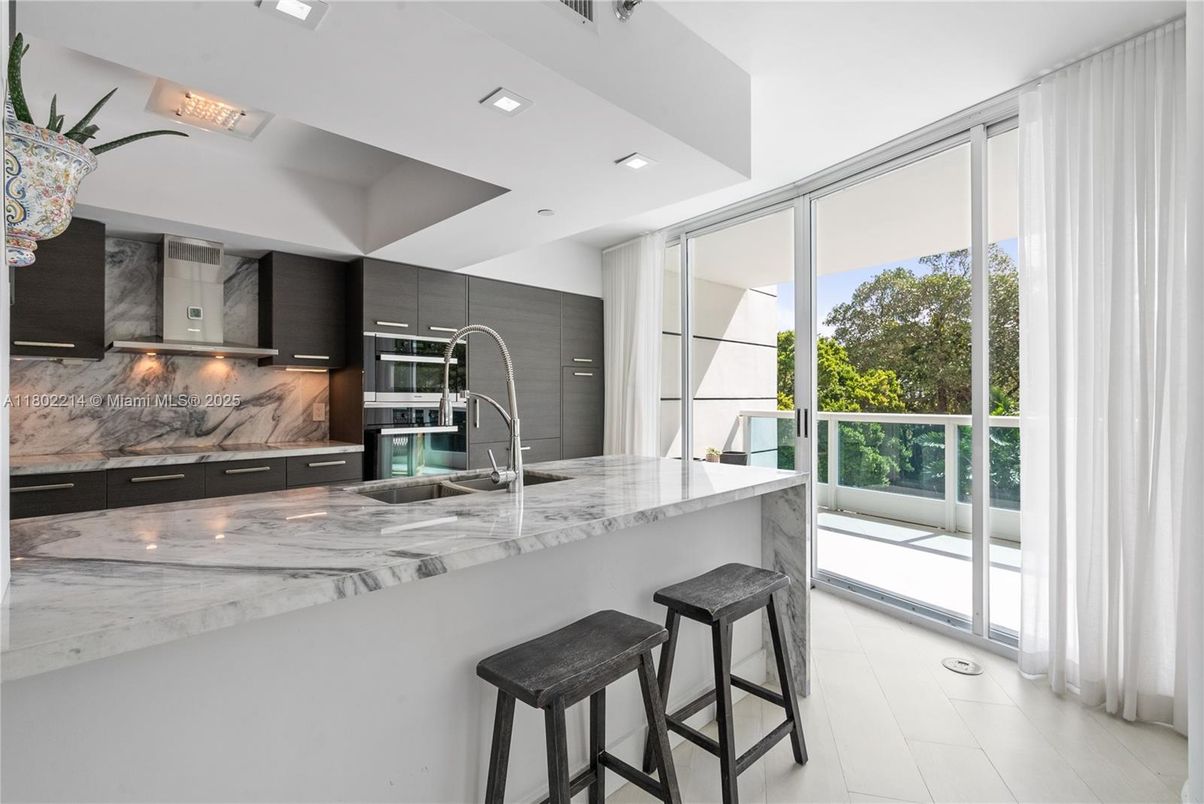 Interior, Kitchen, Marble Walls, Recessed Lighting, Stainless Steel Appliances